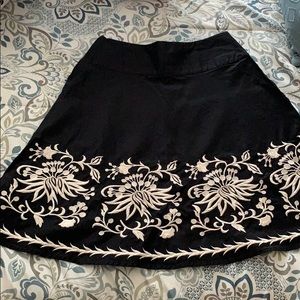 WHBM black skirt with white floral embroidery